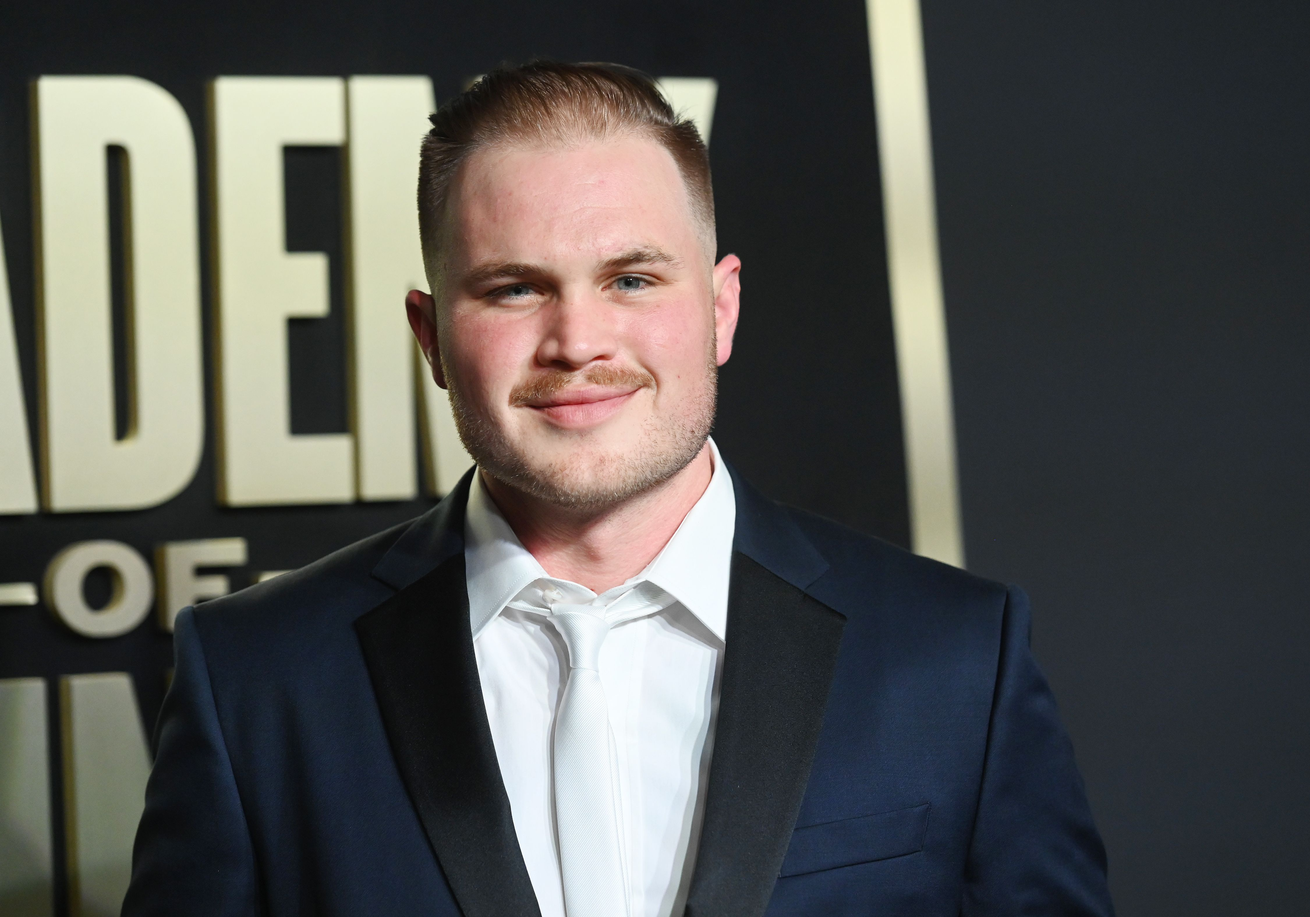 alt="Zach Bryan net worth influenced by album sales and streaming"