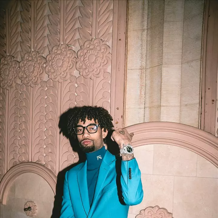 alt="PNB Rock net worth with luxury cars collection"